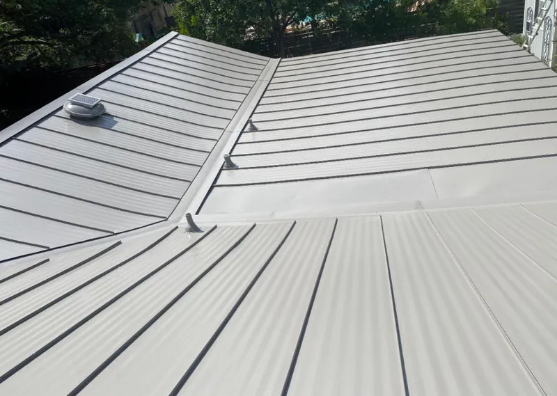 Solar attic fan installed on a metal roof for Roof Ventilation in Sandston
